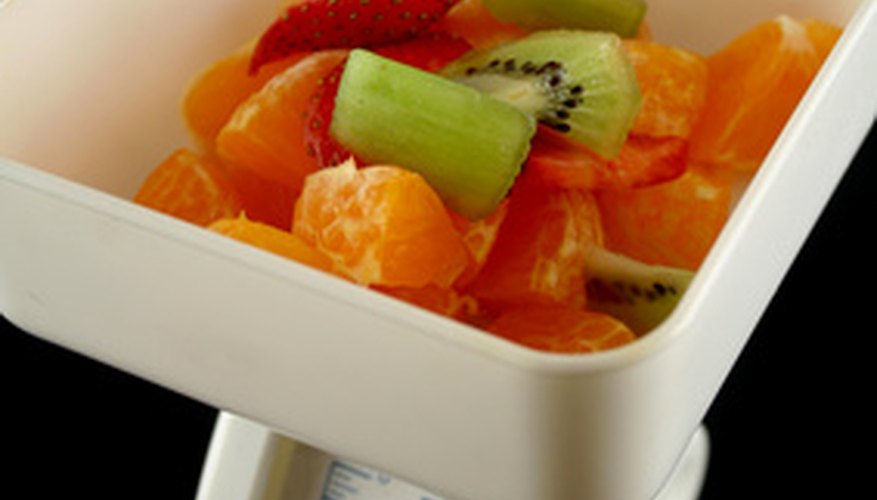 Photo Credit: Kitchen Scales 2 image by Brett Mulcahy from <a href='http://www.fotolia.com'>Fotolia.com</a> Cooking offers many opportunities to practice math skills.