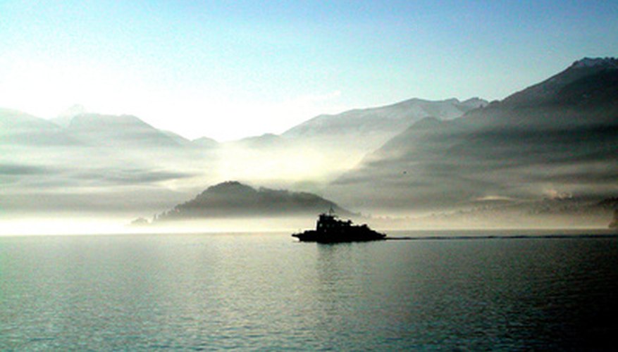 Photo Credit: lago di como - winter atmosphere image by Raffaele Galbiati from <a href='http://www.fotolia.com'>Fotolia.com</a> The atmosphere isn't completely translucent. It scatters a bit of blue light, which is why the sky is blue.
