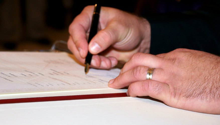 Photo Credit: signature image by kuhar from <a href='http://www.fotolia.com'>Fotolia.com</a> Sign the deed of incorporation in front of a notary.