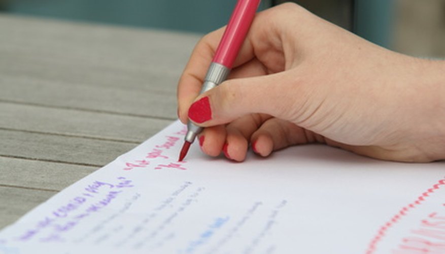Photo Credit: writing image by Alison Bowden from <a href='http://www.fotolia.com'>Fotolia.com</a> Write down a list of goals.