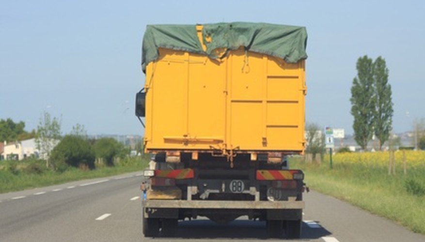 The advantages of using a tarp, such as the one on this truck, are durability and strong rivets for the bungee cords The advantages of using a tarp, such as the one on this truck, are durability and strong rivets for the bungee cords