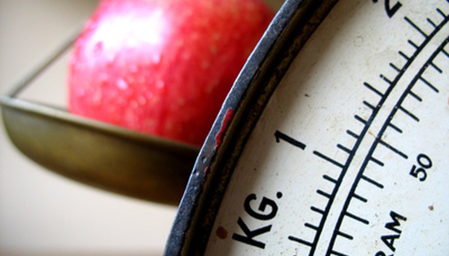 Photo Credit: apple on scale (focus on scale) image by Pontus Edenberg from <a href='http://www.fotolia.com'>Fotolia.com</a> It's easy to measure mass and density.
