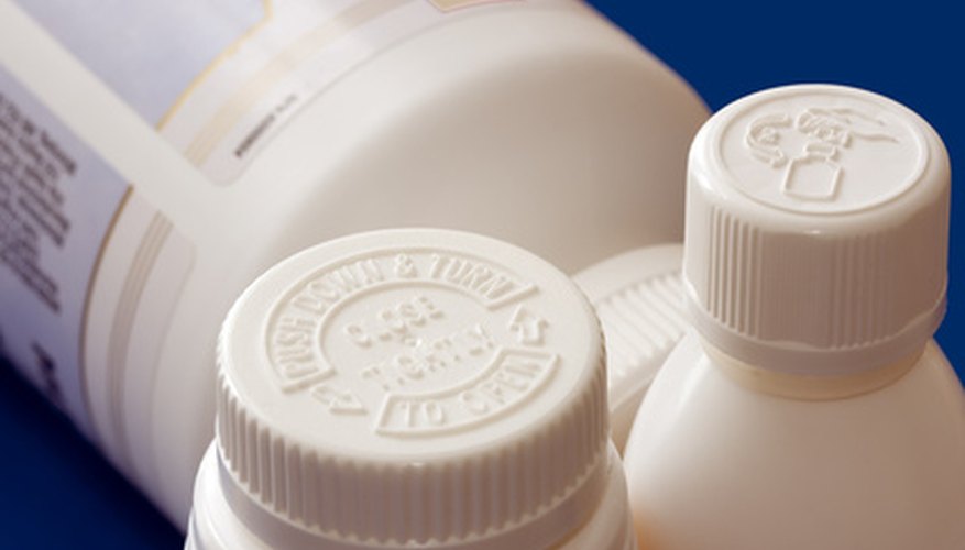 Photo Credit: pill bottles image by igor kisselev from <a href='http://www.fotolia.com'>Fotolia.com</a> Restricted or dangerous products may be protected by tamper-evident packaging.