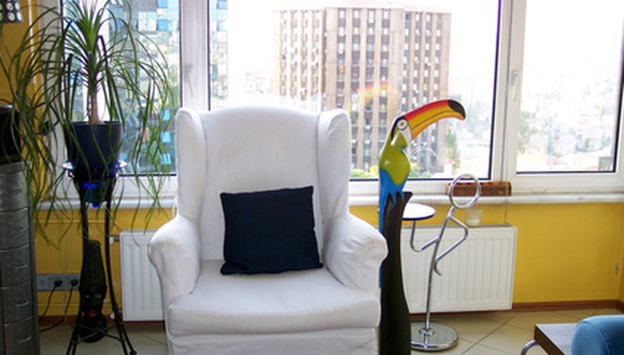 American style wingback chairs feature simpler lines and muted colors. American style wingback chairs feature simpler lines and muted colors.