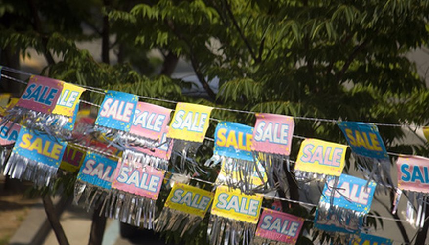 Photo Credit: sale image by Angelika Bentin from <a href='http://www.fotolia.com'>Fotolia.com</a> Flea markets are a great place to sell secondhand items.