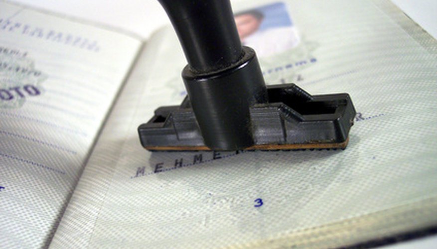 Photo Credit: passport approval image by timur1970 from <a href='http://www.fotolia.com'>Fotolia.com</a> You must provide a copy of your passport or driver's license.