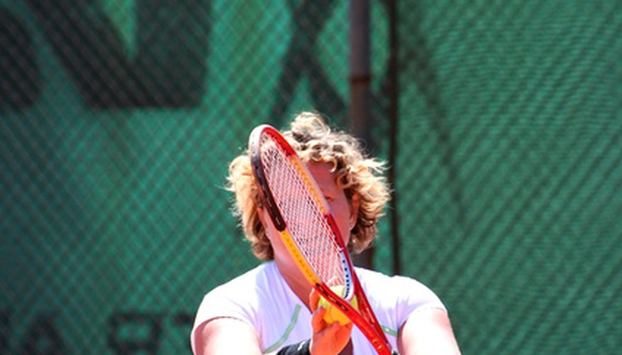 Photo Credit: tennis image by Snezana Skundric from <a href='http://www.fotolia.com'>Fotolia.com</a> Videotaping a serve can yield data for measuring the ball's speed.