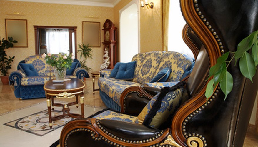 Queen Anne style wingbacks include decorative wood detailing and curved legs. Queen Anne style wingbacks include decorative wood detailing and curved legs.