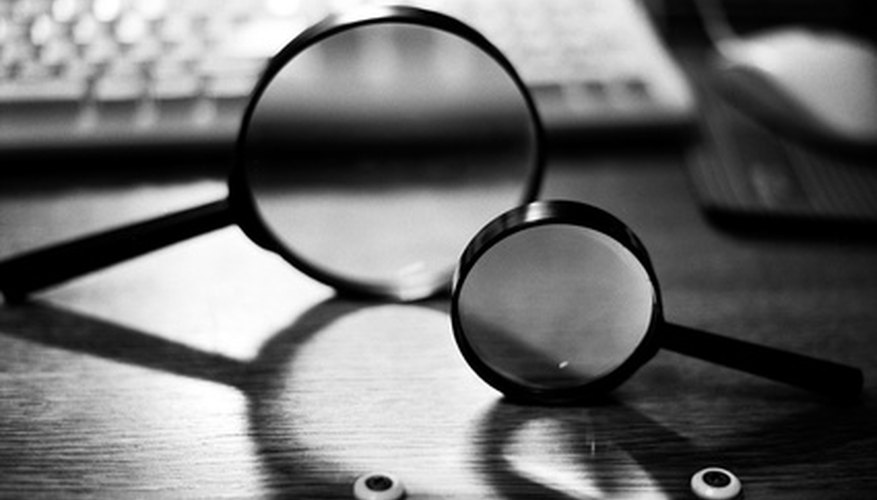Photo Credit: lens image by Sergey Pesterev from <a href='http://www.fotolia.com'>Fotolia.com</a> Forms of two basic equations allow computation of the height and distance of an image.