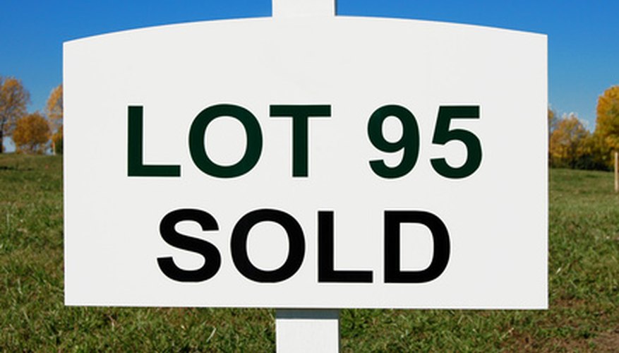 Photo Credit: sold sign image by Stephen VanHorn from <a href='http://www.fotolia.com'>Fotolia.com</a>