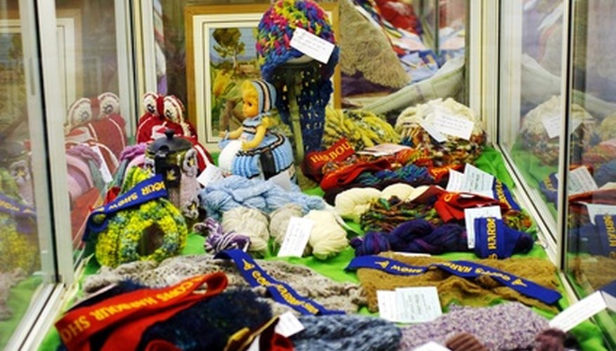 Photo Credit: county fair 1. image by mdb from <a href='http://www.fotolia.com'>Fotolia.com</a> Organize clothing neatly in theme sections.