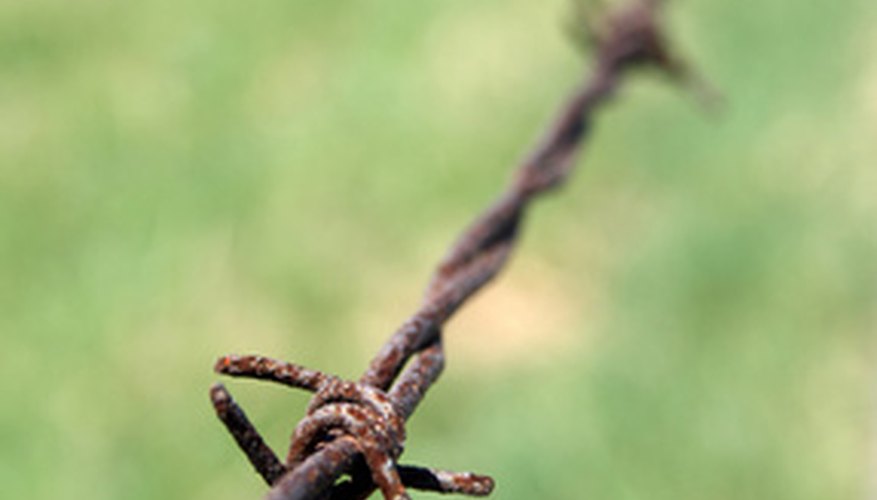 Barbed wire fences must meet specific regualtions to be legal. Barbed wire fences must meet specific regualtions to be legal.