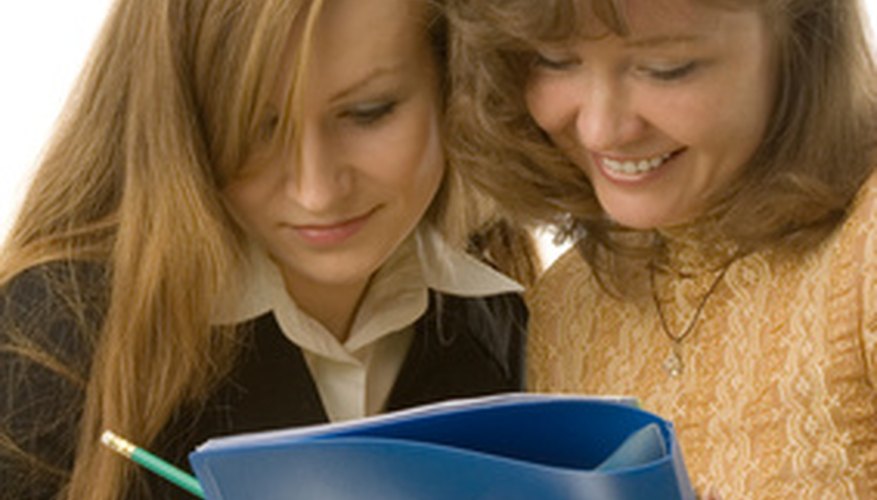 Photo Credit: women with folder image by Valentin Mosichev from <a href='http://www.fotolia.com'>Fotolia.com</a> Women have a difficult time accepting compliments.