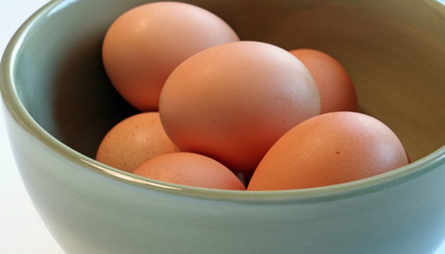 Photo Credit: eggs, green bowl on white image by Andrew Gentry from <a href='http://www.fotolia.com'>Fotolia.com</a> Display the eggs in a bowl of crushed ice to keep them fresh.