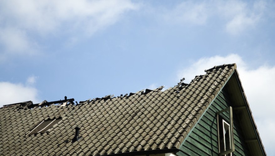 Falling trees can cause serious damage to a roof. Falling trees can cause serious damage to a roof.