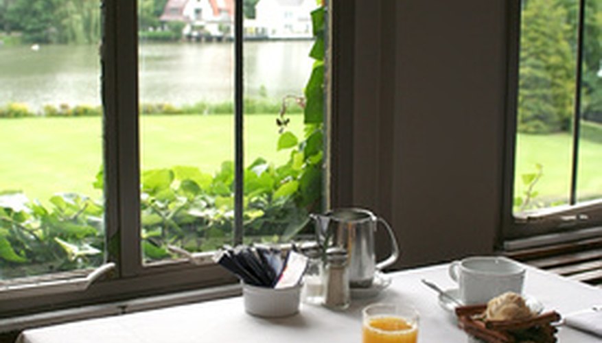 Photo Credit: Hotel breakfast with summer view outside window image by araraadt from <a href='http://www.fotolia.com'>Fotolia.com</a> Looking out the window to see birds at your feeder is the most rewarding part.
