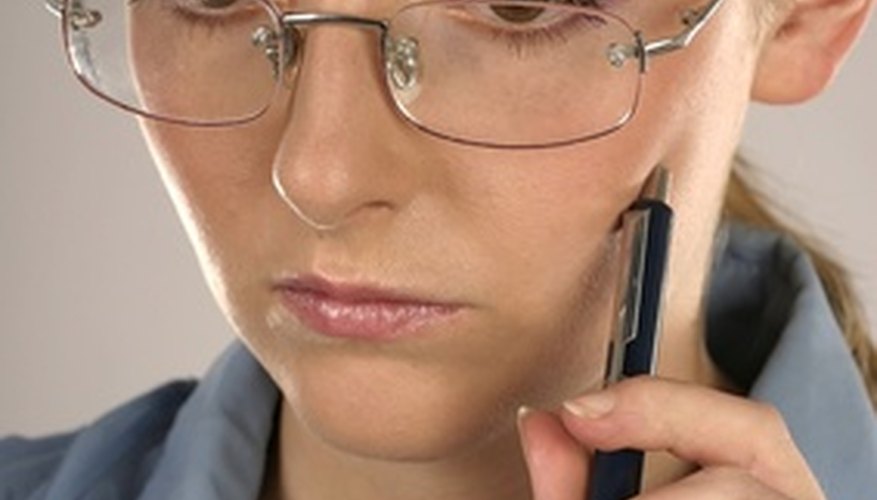 Photo Credit: woman holding a pen image by forca from <a href='http://www.fotolia.com'>Fotolia.com</a> You must complete and submit a food vending license application.