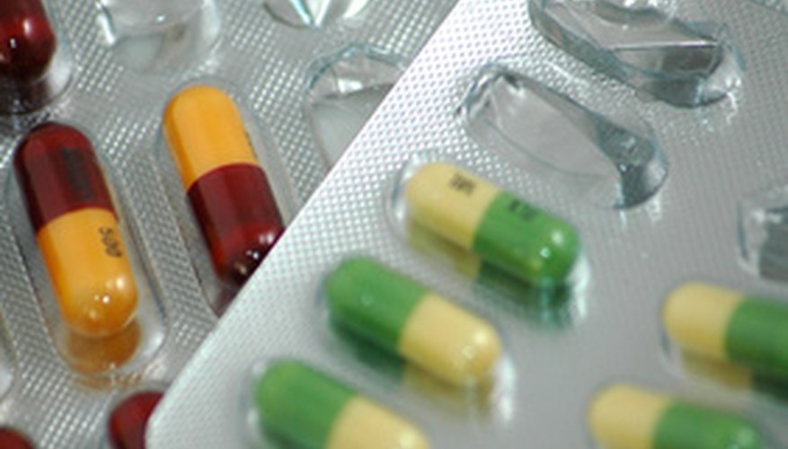 Photo Credit: Pills against white image by Warren Millar from <a href='http://www.fotolia.com'>Fotolia.com</a> Medication is often packaged in blister packs.