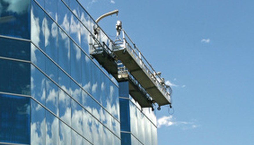 Suspension scaffolding on a highrise building Suspension scaffolding on a highrise building