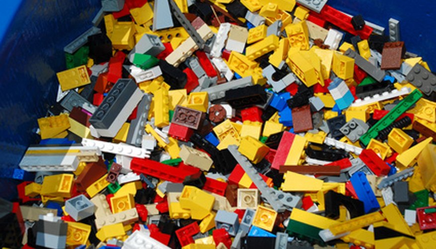 Photo Credit: bucket of blocks image by Quennie Chua from <a href='http://www.fotolia.com'>Fotolia.com</a> Watson & Crick used interconnecting metal for their model, though any building blocks will do.