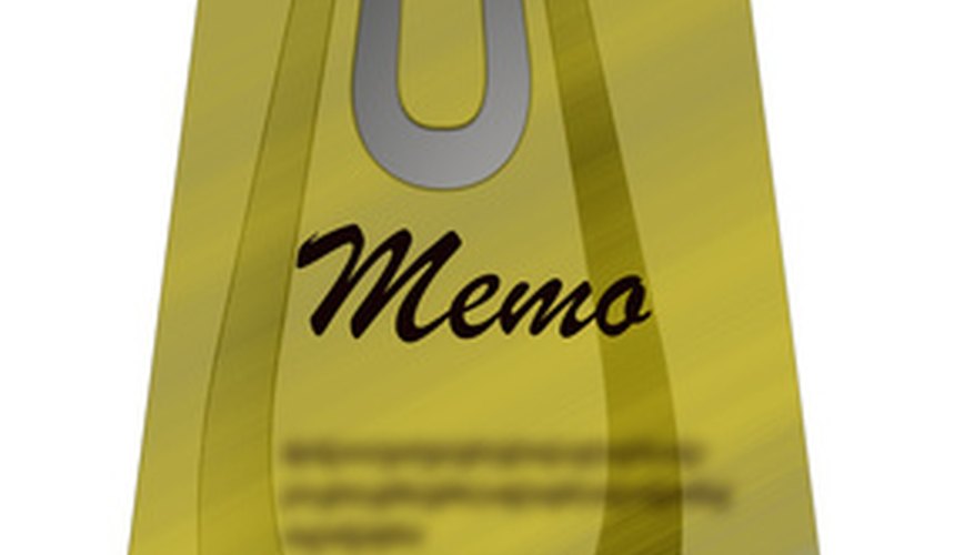 Photo Credit: memo image by Angie Lingnau from <a href='http://www.fotolia.com'>Fotolia.com</a> Use traditional memo format for both progress and quarterly reports.