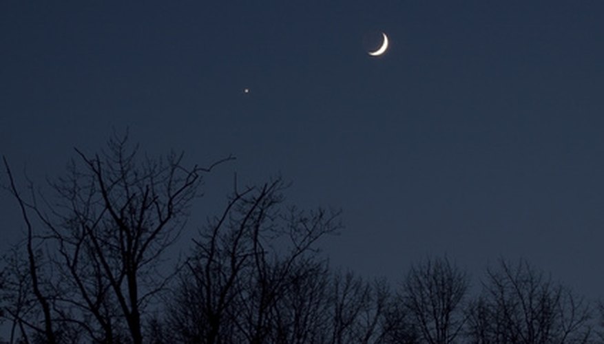 Photo Credit: Moon meets Venus image by deepsky from <a href='http://www.fotolia.com'>Fotolia.com</a> Venus sometimes appears near the moon.