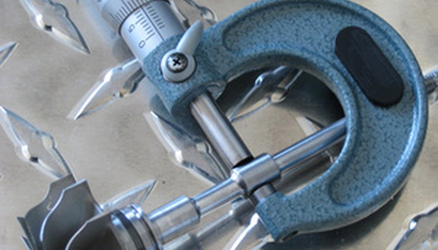 Photo Credit: Midiendo image by andoni from <a href='http://www.fotolia.com'>Fotolia.com</a> You can use a micrometer to determine the volume of a marble.
