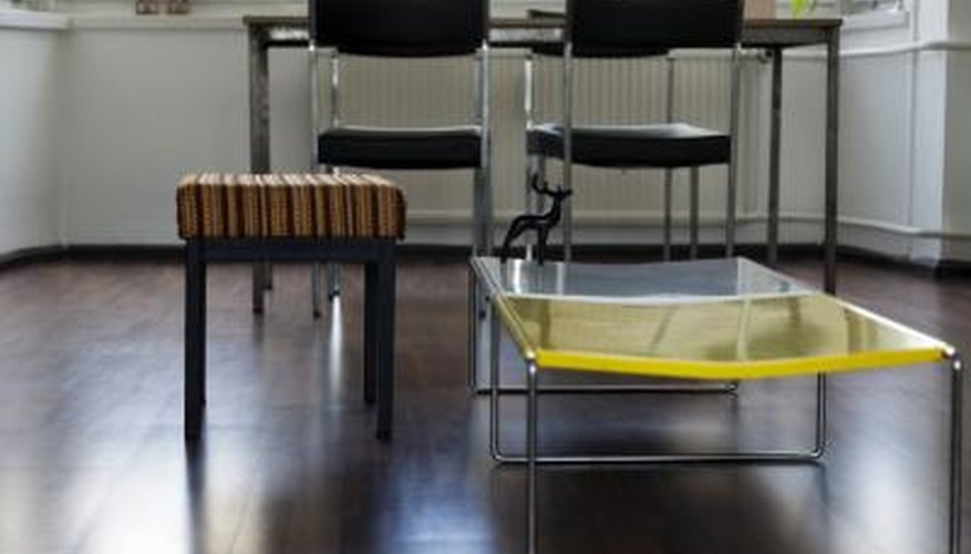 An ottoman next to a coffeetable in an open modern living space. An ottoman next to a coffeetable in an open modern living space.