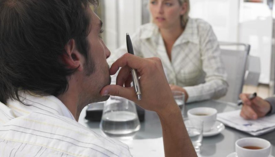A businesswoman and man are working together.