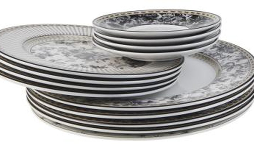 Glue a variety of dishes together to create a tiered centerpiece. Glue a variety of dishes together to create a tiered centerpiece.