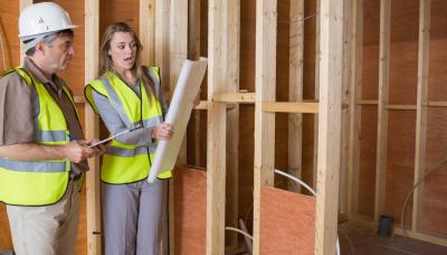 Contractor talking about construction plans Contractor talking about construction plans