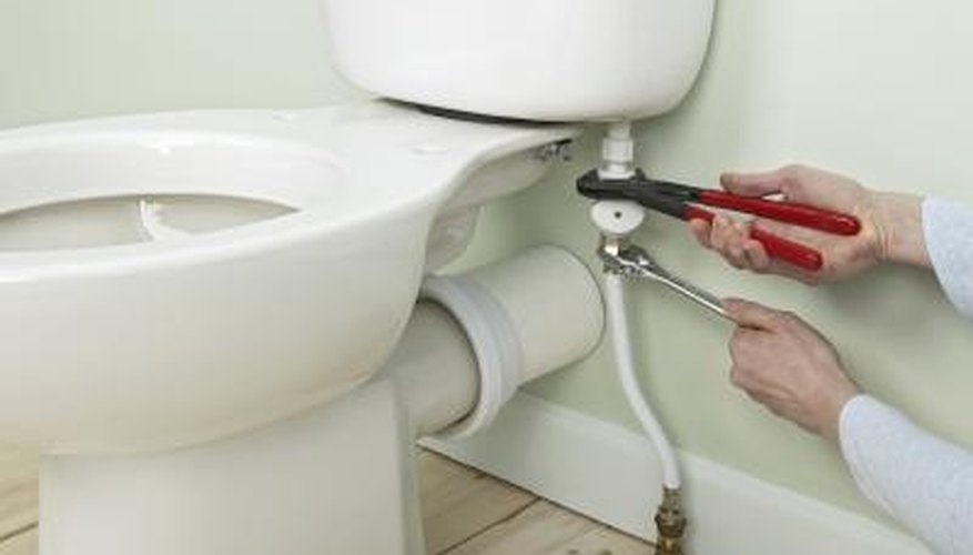 Man working on toilet Man working on toilet