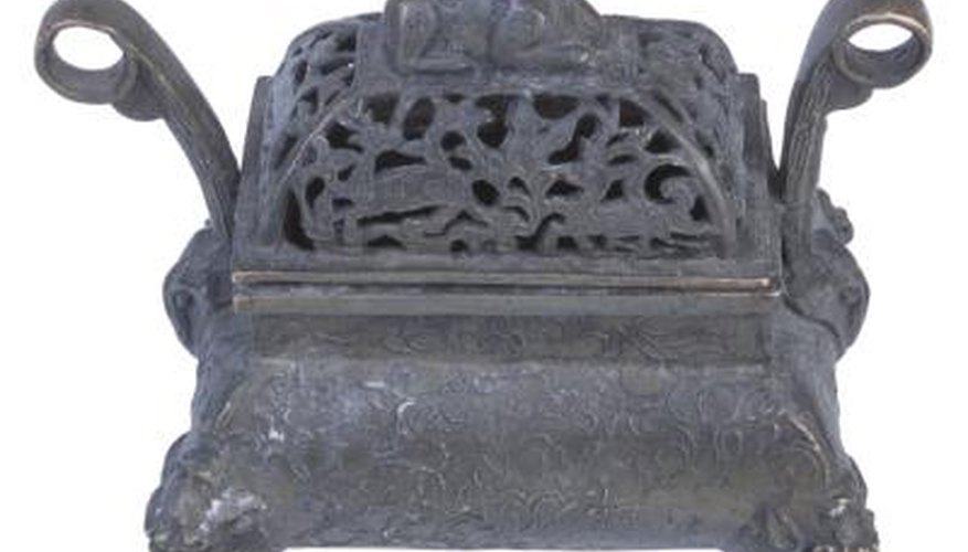 An antique cast iron stove can serve as a fire pit. An antique cast iron stove can serve as a fire pit.