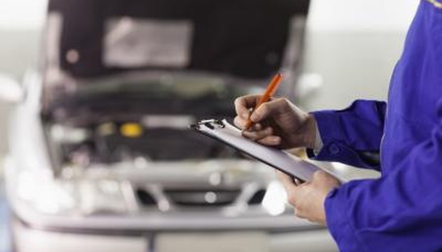 Photo Credit: Wavebreakmedia Ltd/Wavebreak Media/Getty Images Man working on car engine