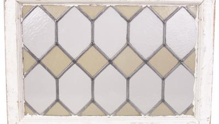 Tudor-style diamond-pane window patterns can be applied to standard windows. Tudor-style diamond-pane window patterns can be applied to standard windows.