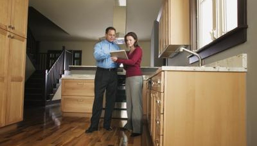 Couple inspecting kitchen Couple inspecting kitchen