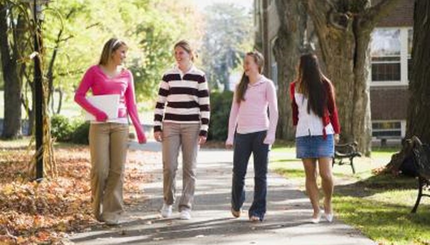 Smiling students walking around campus
