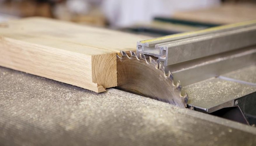 Circular saw cutting a piece of wood. Circular saw cutting a piece of wood.