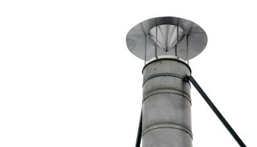 A metal chimney cowl with a "hat." A metal chimney cowl with a "hat."