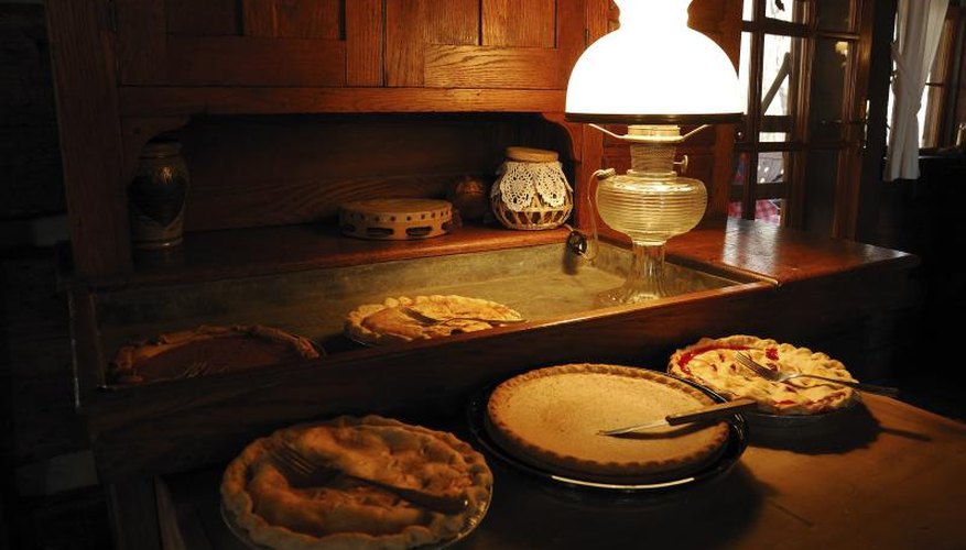 Antique dry sink and cupboard with pies. Antique dry sink and cupboard with pies.