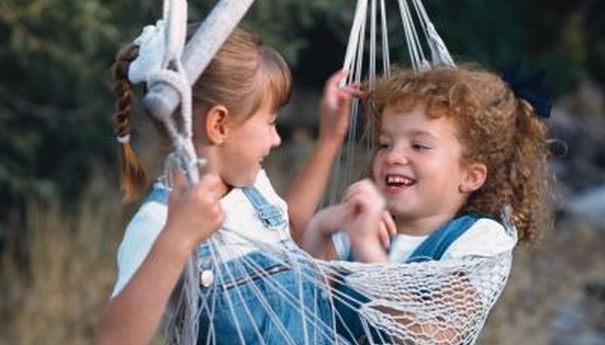 Hammock swings hang from one hook, with weight supported by a spreader bar. Hammock swings hang from one hook, with weight supported by a spreader bar.