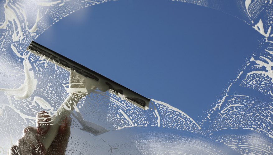 Use a broad, semi-circular stroke to clean large panes. Use a broad, semi-circular stroke to clean large panes.