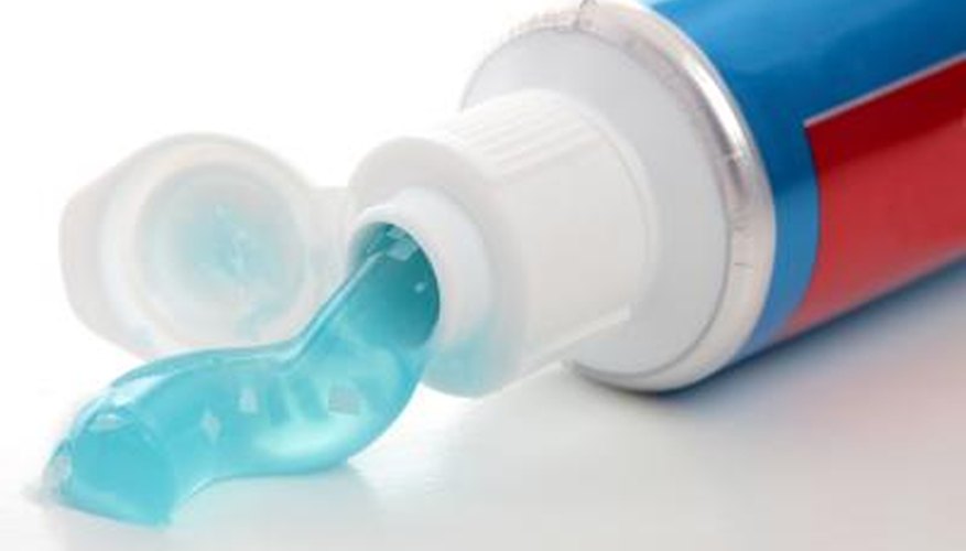 Squeeze out a small amount of toothpaste onto your finger. Squeeze out a small amount of toothpaste onto your finger.
