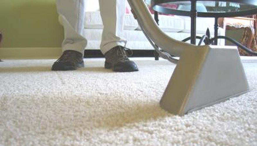 Photo Credit: Kirk Johnson/iStock/Getty Images Carpet being cleaned with industrial vaccum