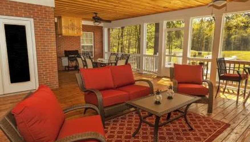 A sunroom with honey toned hardwood flooring. A sunroom with honey toned hardwood flooring.