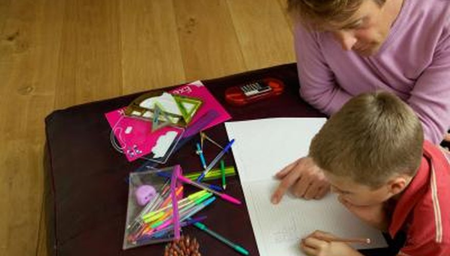 Photo Credit: Ableimages/Photodisc/Getty Images Father helping son with math homework.