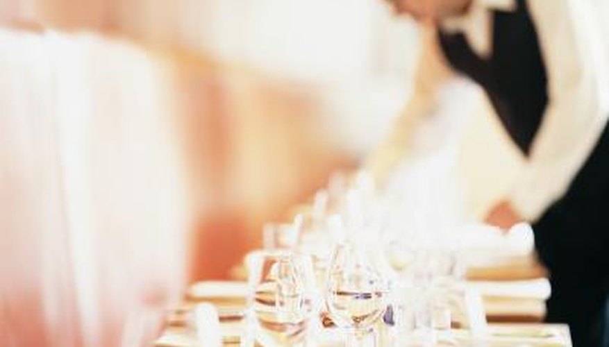Photo Credit: Digital Vision./Photodisc/Getty Images Waiter setting table