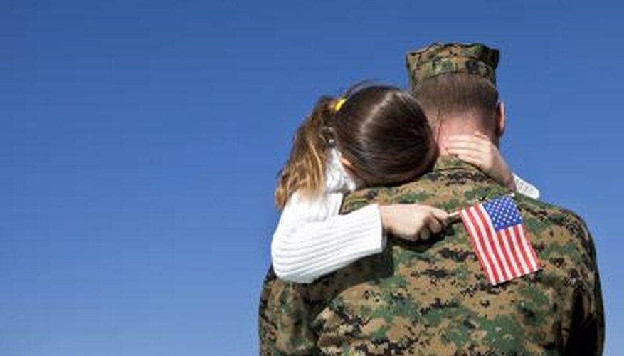 Young child hugging veteran father