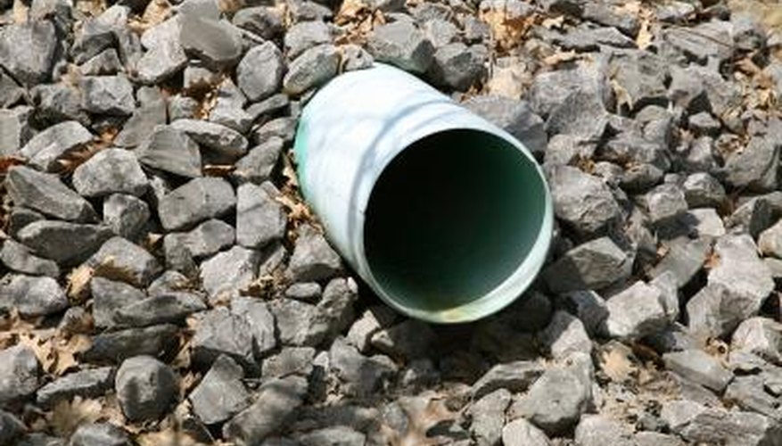 Drain water away from your house with a French drain. Drain water away from your house with a French drain.