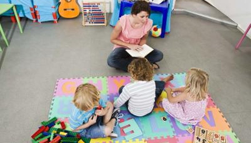 Photo Credit: Jupiterimages/Goodshoot/Getty Images Children on mat listen to care giver